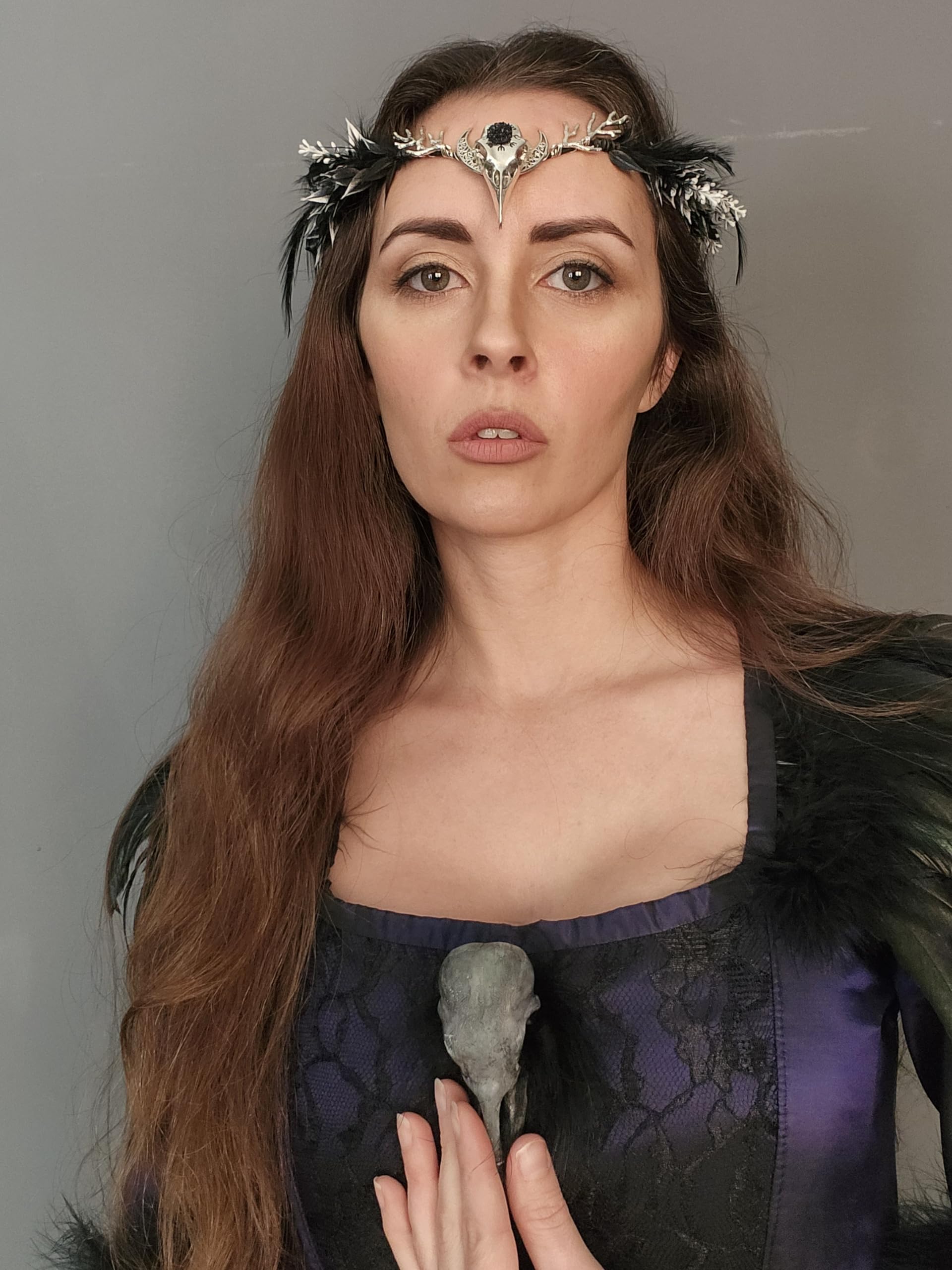 MOSTORY raven feather crown side profile shows detailed leaves and dark shimmer
