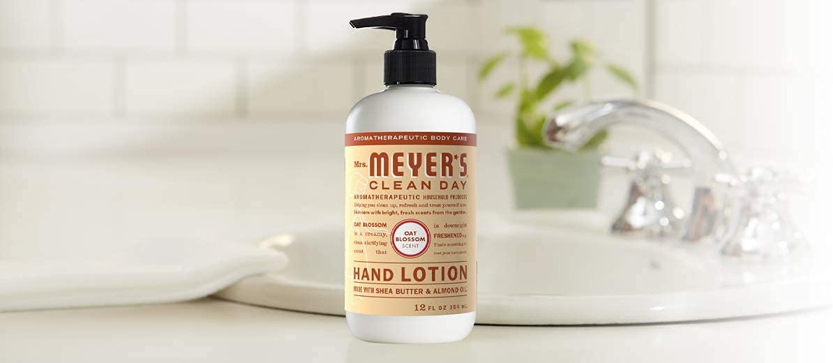 Oat Blossom lotion tube next to towels in a daily routine setting.
