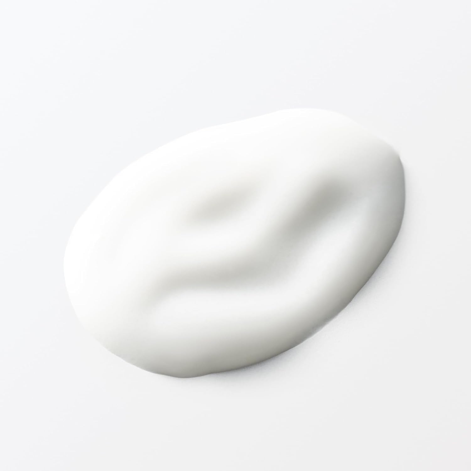 MUJI lotion in soft lighting emphasizes gentle care for delicate skin.