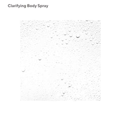 Murad Clarifying Body Spray mist-application shows fine mist for even coverage across shoulders.
