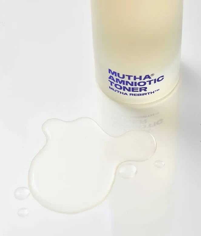 Close-up of a cotton pad applying MUTHA Rebirth Amniotic Toner for even absorption.