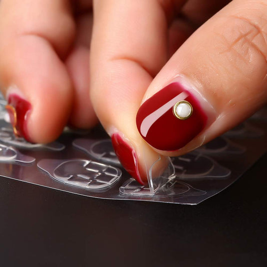 Mwellewm double-side glue tabs closeup for secure, lightweight nail attachment.