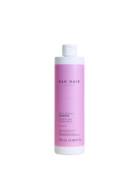 NAK Rose Blonde Shampoo bottle pours to reveal rose pink tones.