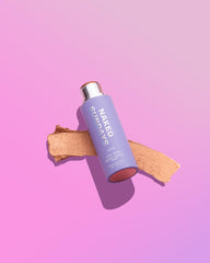 Naked Sundays SPF50 glow balm Bronze toward eyes and lips for warm sun-kissed glow.