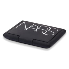 NARS Exhibit A vegan pigments provide rich color with pearlescent blur.