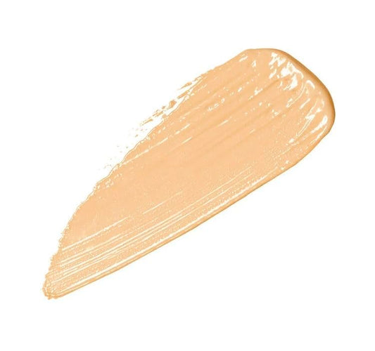 Applying NARS Radiant Creamy Concealer Nougatine under the eye for brightness