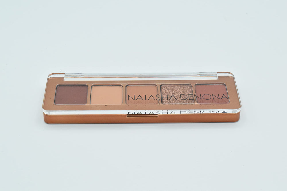 Natasha Denona MINI BRONZE application shot demonstrates seamless blending for smoky bronze or shimmer.