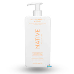 Native Toasted Vanilla & Honey conditioner bottle nourishes and hydrates dry hair.