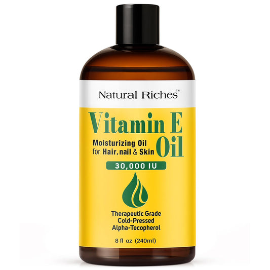 Natural Riches Vitamin E Oil bottle closeup, pure formula for skin care.