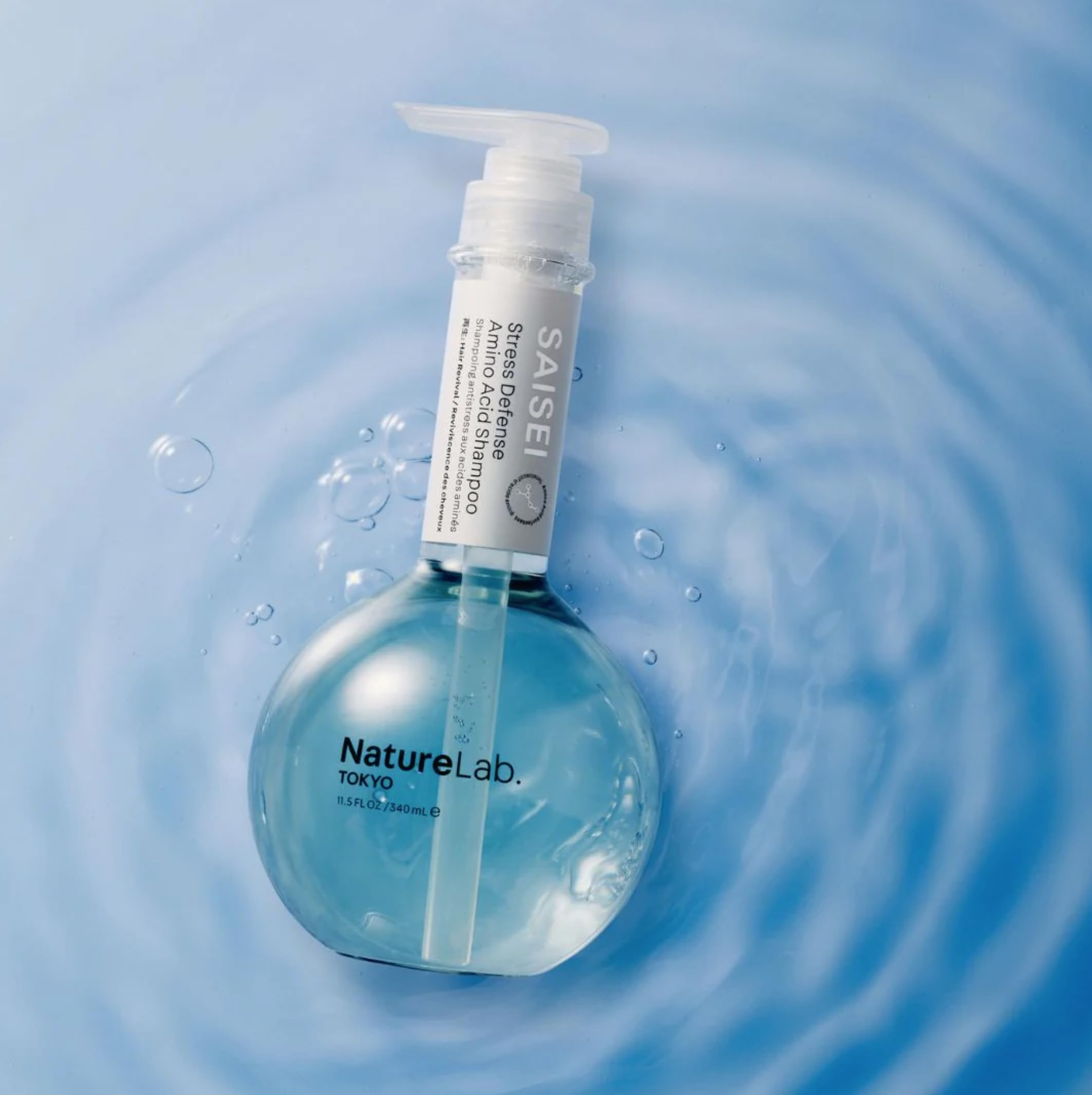 NatureLab.TOKYO SAISEI Stress Defense Amino Acid Shampoo bottle with botanical ingredients graphic
