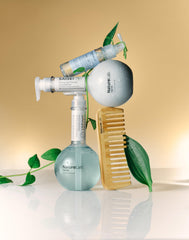 NatureLab.TOKYO SAISEI Stress Defense Amino Acid Shampoo travel-size context for on-the-go care