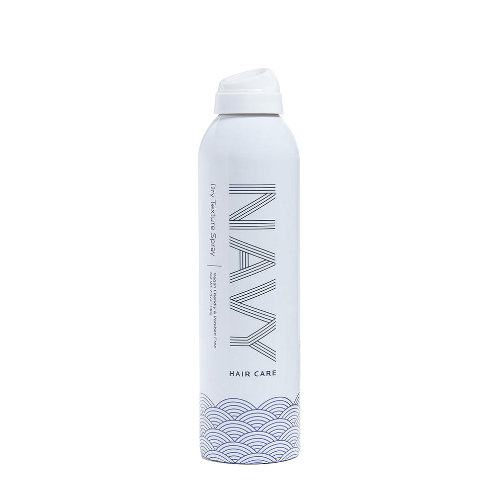 Navy Hair Care Dry Texture Spray bottle offers lightweight hold for voluminous looks.