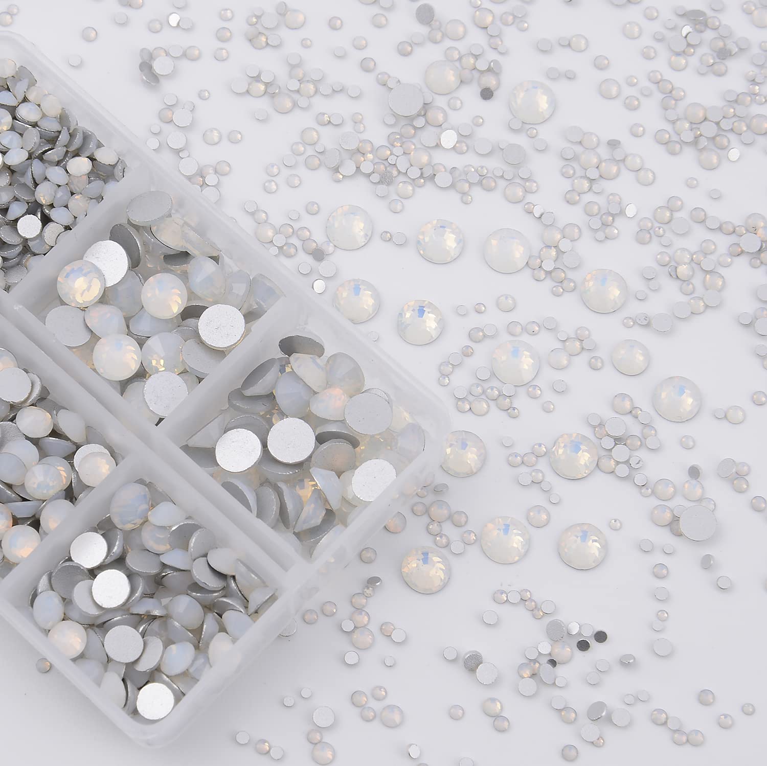 NCB 8000pcs glass rhinestones sparkle with bright facets under light.