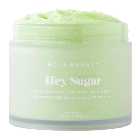 NCLA Beauty Hey Sugar body scrub jar showing exfoliating texture for smoother skin.