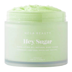 NCLA Beauty Hey Sugar body scrub jar showing exfoliating texture for smoother skin.