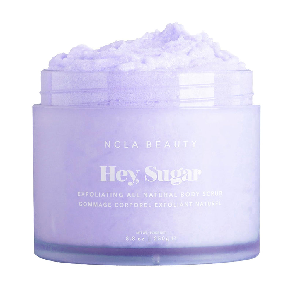 NCLA Beauty Hey Sugar scrub bottle highlights mango butter for moisturized skin.