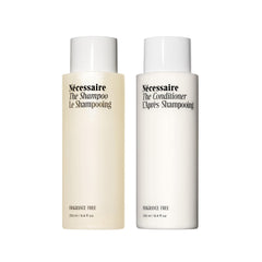 Nécessaire Hair Duo shampoo bottle shown, fragrance-free cleanse for sensitive scalps and hydration.