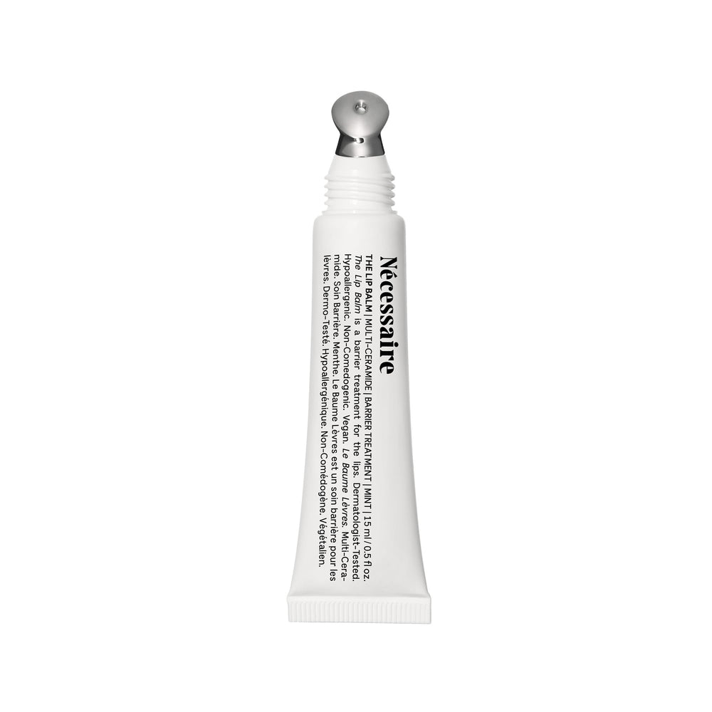 Nécessaire Lip Balm tube application for on-the-go hydration.