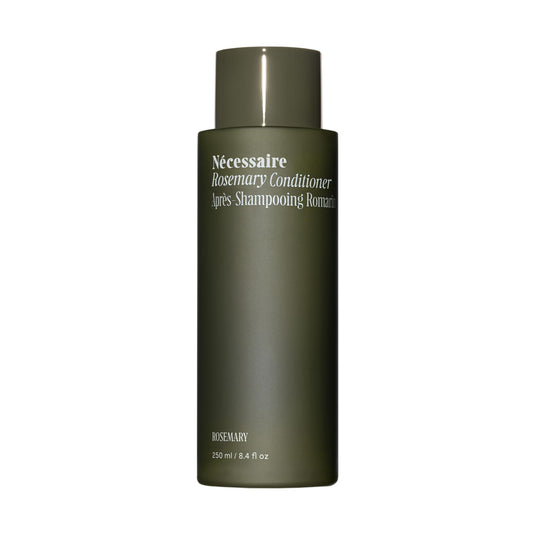 Nécessaire Rosemary Conditioner bottle on bathroom shelf for daily strengthening