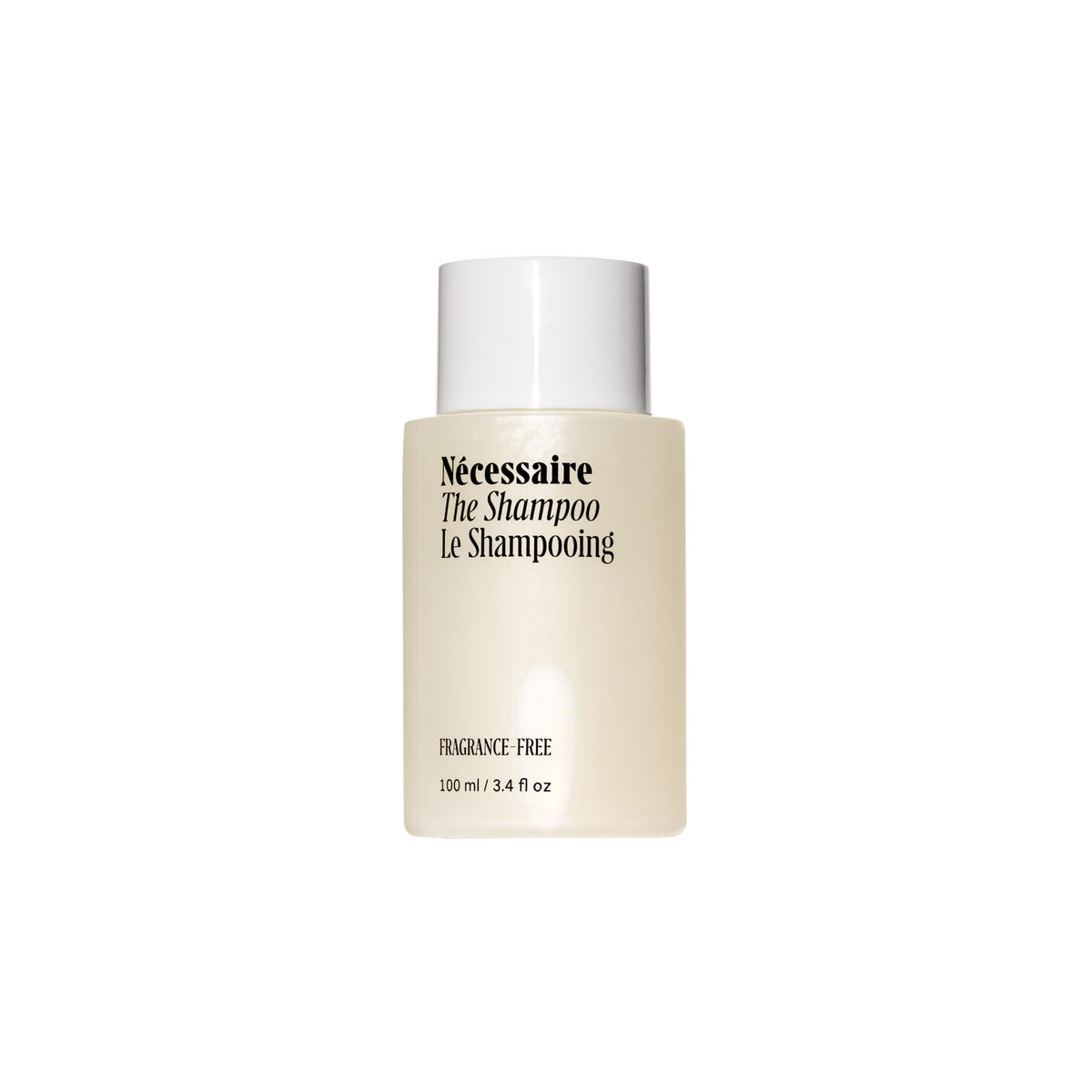 Nécessaire Shampoo Mini bottle front view, fragrance-free gentle cleansing for sensitive scalps.
