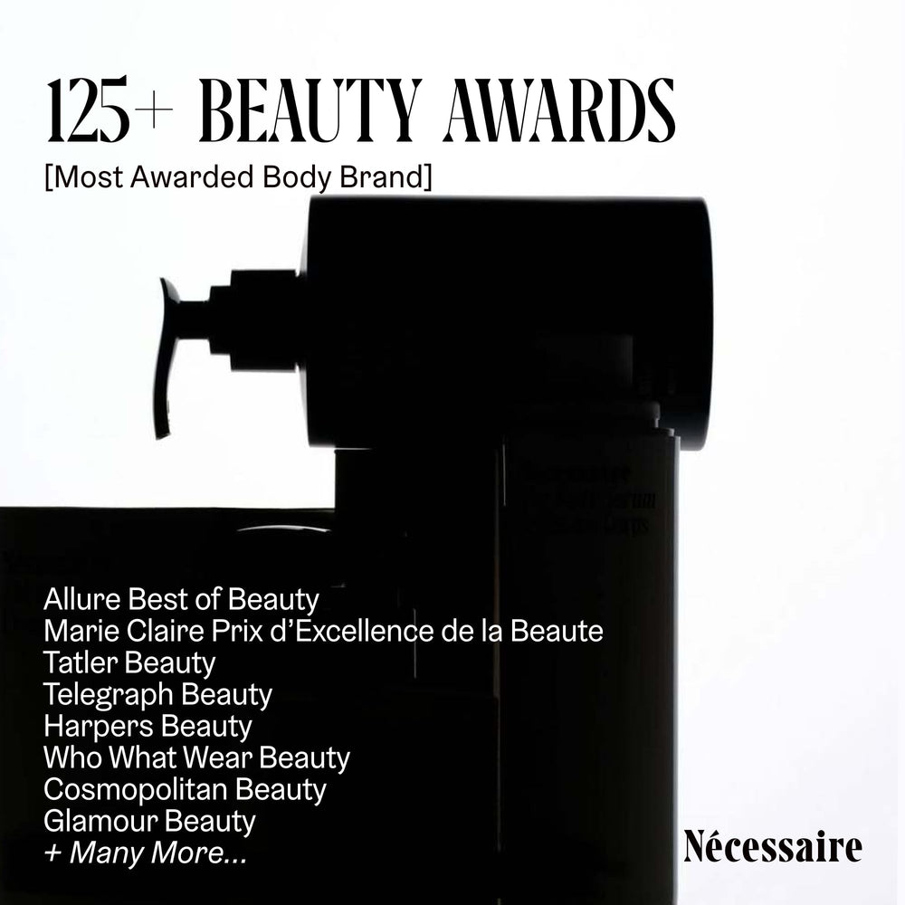 Nécessaire Shampoo Mini closeup with hyaluronic acid highlights deep hydration during wash.