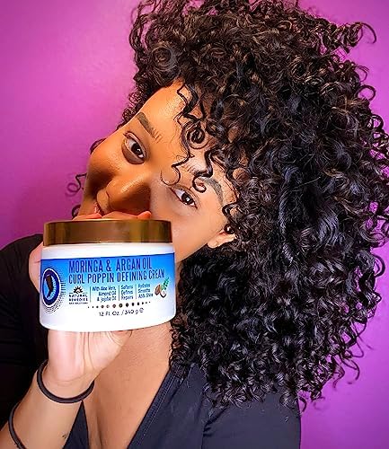 Nefertiti's Secrets Moringa Oil hydrated curls close-up shows moisture and shine.