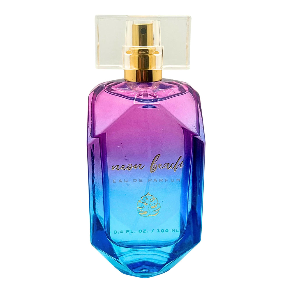 Neon Beach Eau de Parfum bottle with pour shot, long-lasting coastal aroma.