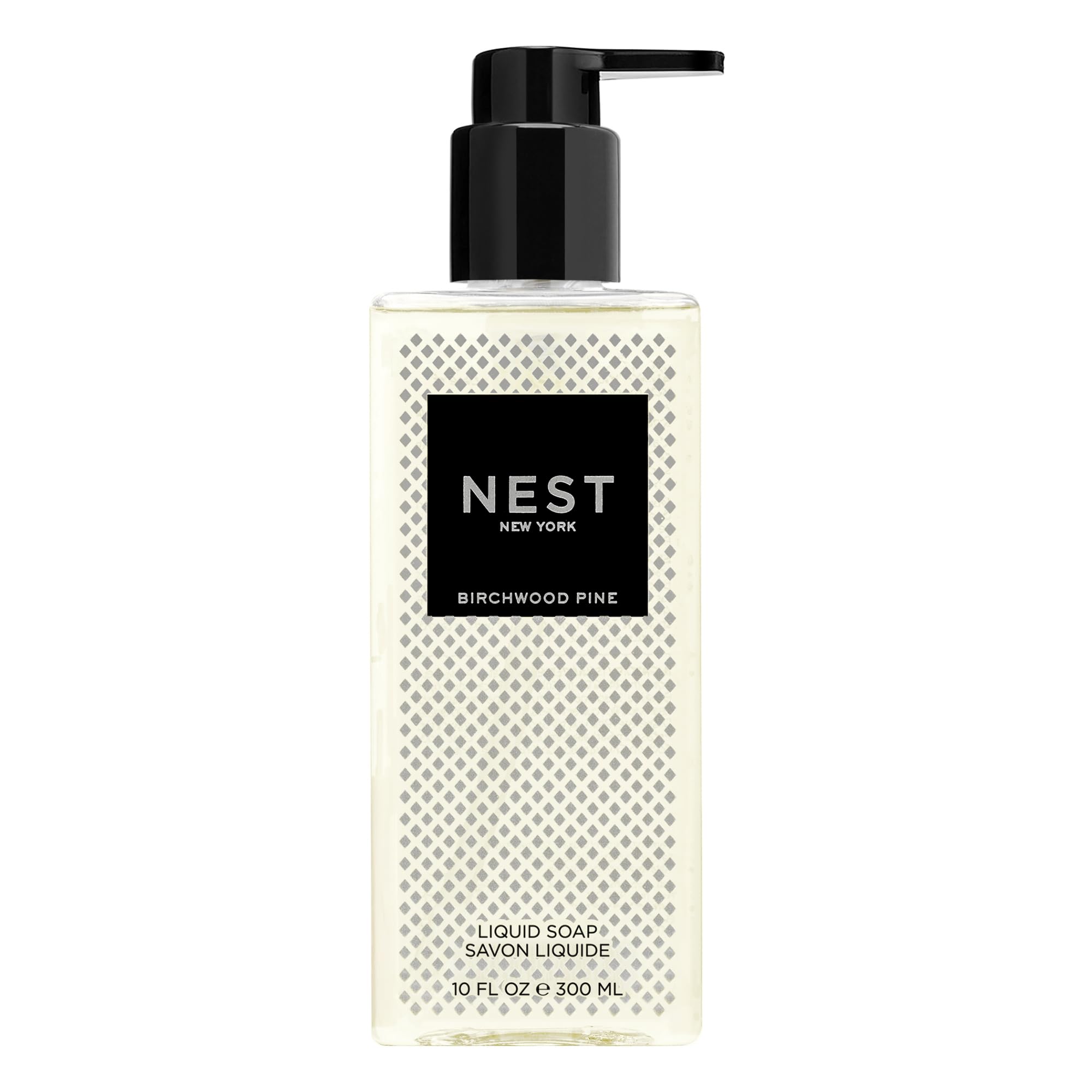 NEST New York Birchwood Pine liquid soap bottle pouring, delivering clean hands with subtle, aromatic notes.