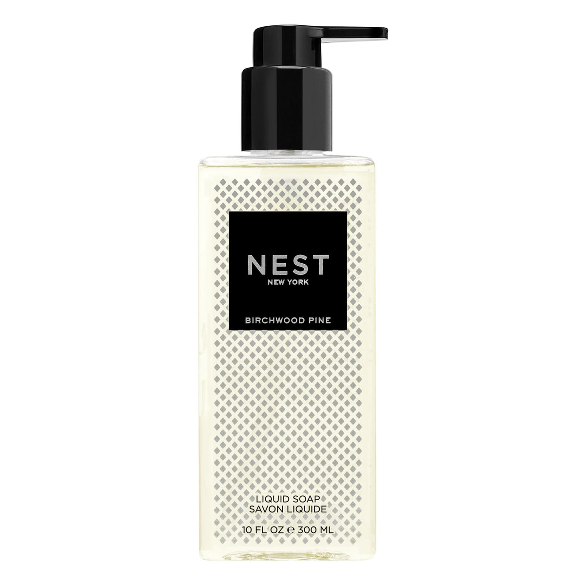 NEST New York Birchwood Pine liquid soap bottle pouring, delivering clean hands with subtle, aromatic notes.
