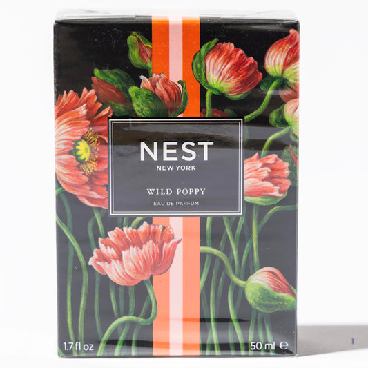 Nest New York Wild Poppy bottle on pink backdrop, vibrant fruity floral energy.