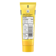 Beach scene with Neutrogena Beach Defense SPF 70 ready for sun protection.