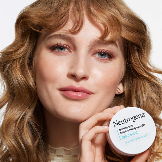 Neutrogena Hydro Boost setting powder applied with brush for lightweight, pore-blurring coverage.