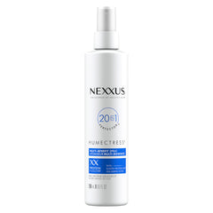 Nexxus Humectress leave-in spray bottle on a bathroom shelf for frizz control