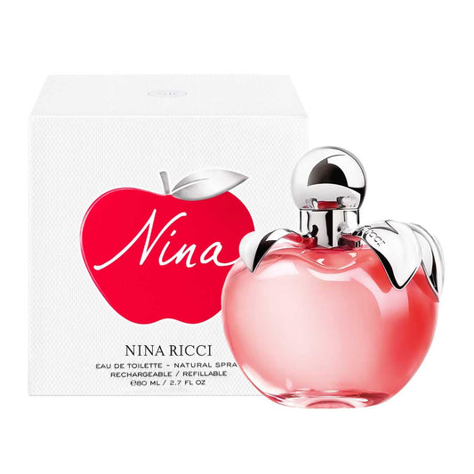 Nina Ricci Nina fragrance bottle with an apple shape and gold leaf cap, elegant and travel-ready.