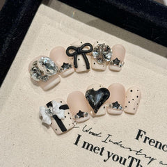 NLSJMP 3D gel nails with rhinestones in a matte white finish for a chic event look.
