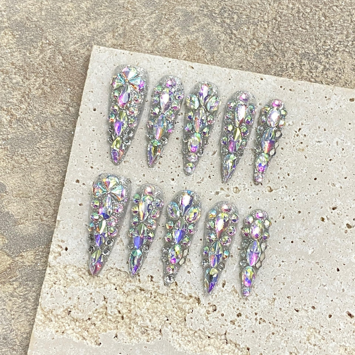 NLSJMP long stiletto almond nails for a polished salon-like finish.