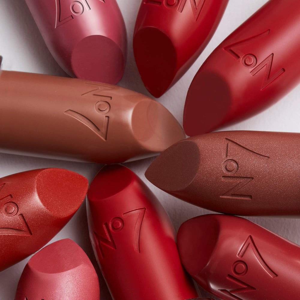 No7 Age Defying Lipstick Soft Cherry swatch on skin demonstrates bold pink shade