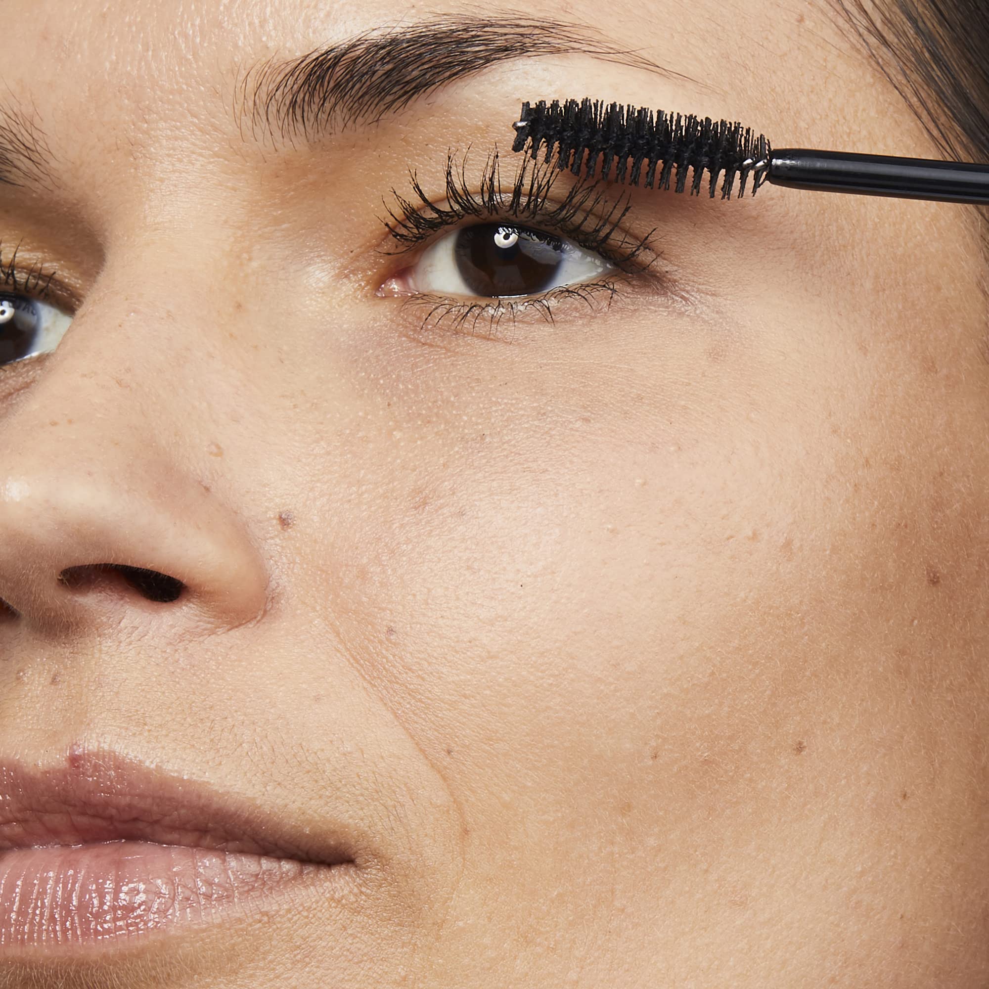 Applying No7 Lash Impact Mascara with a zigzag motion for lift and length.