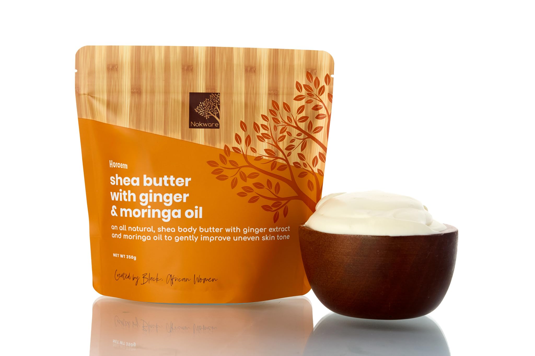 Nokware Raw Shea Butter with moringa and ginger in a jar, nourishing dry skin.