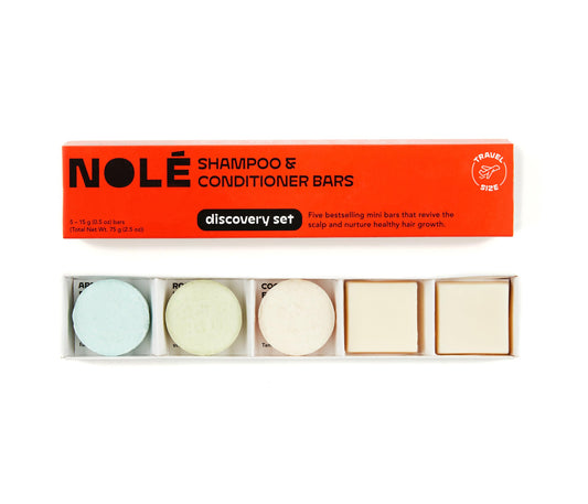 NOLÉ OLE CARE travel shampoo bar in eco-friendly packaging for on-the-go cleansing.