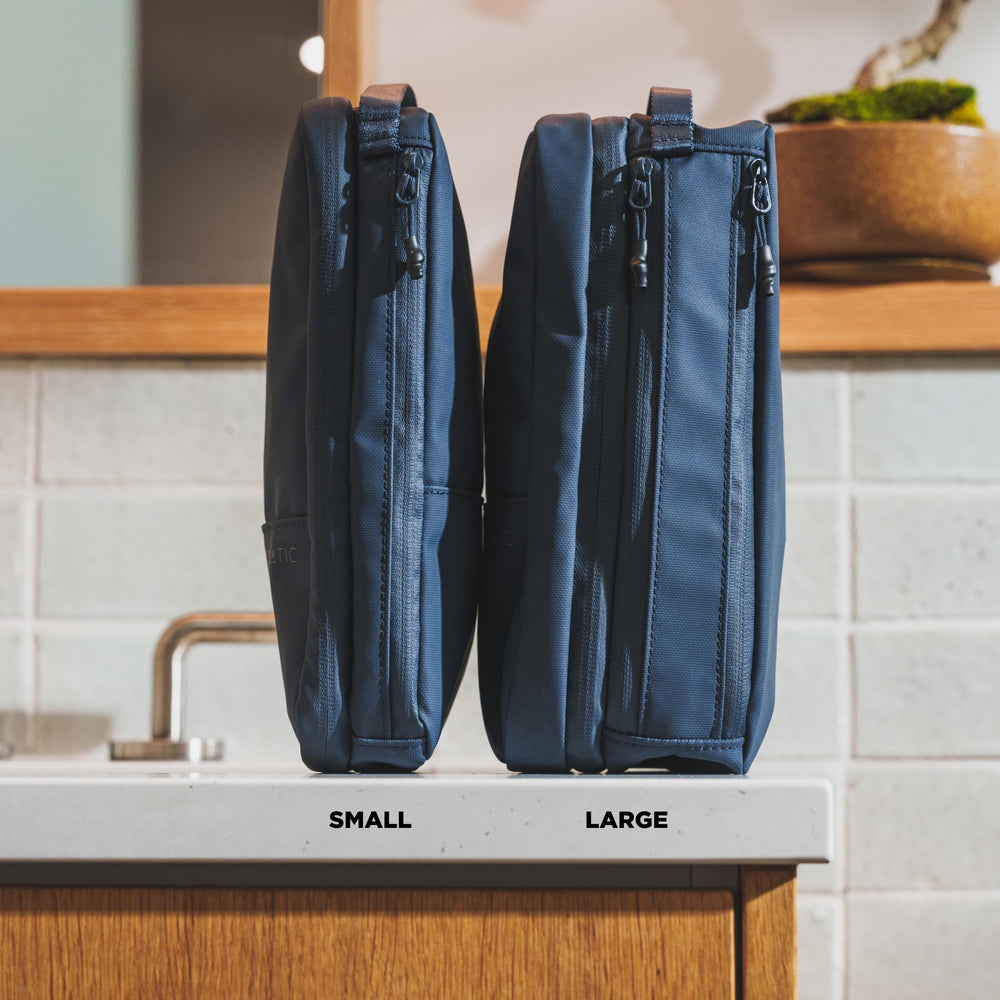 NOMATIC bag with multiple compartments keeps shaving kit and toiletries neatly separated.