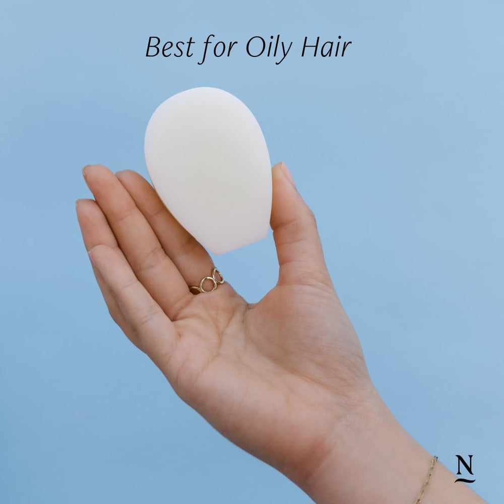 Nopalera Balance conditioner bar on wet hair ready for easy glide.