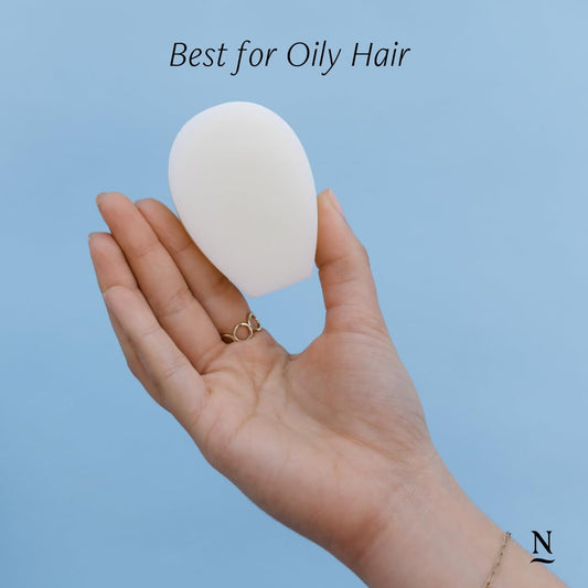 Nopalera Balance conditioner bar on wet hair ready for easy glide.
