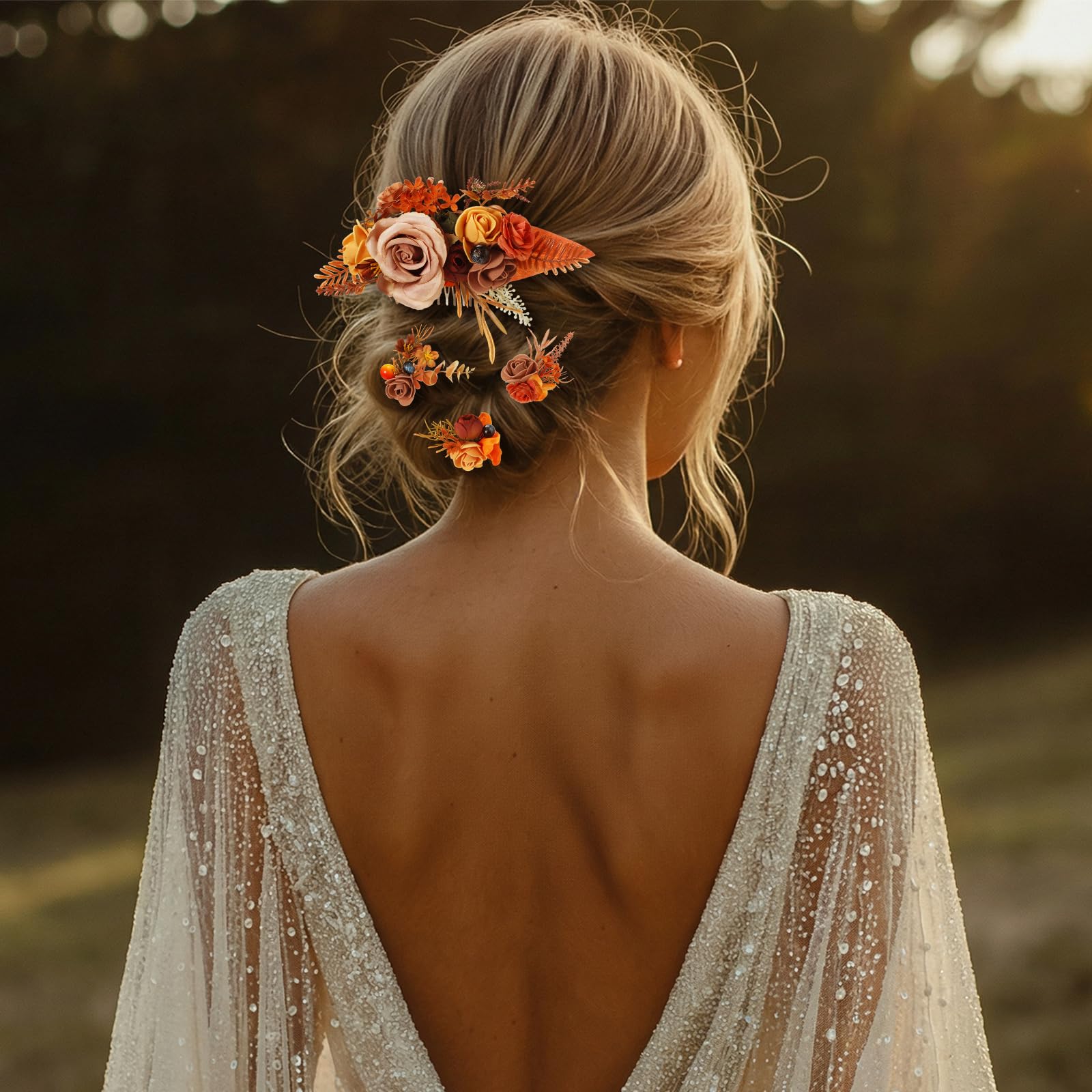 Norme dried rose and eucalyptus accents bring botanical texture to the hairstyle.