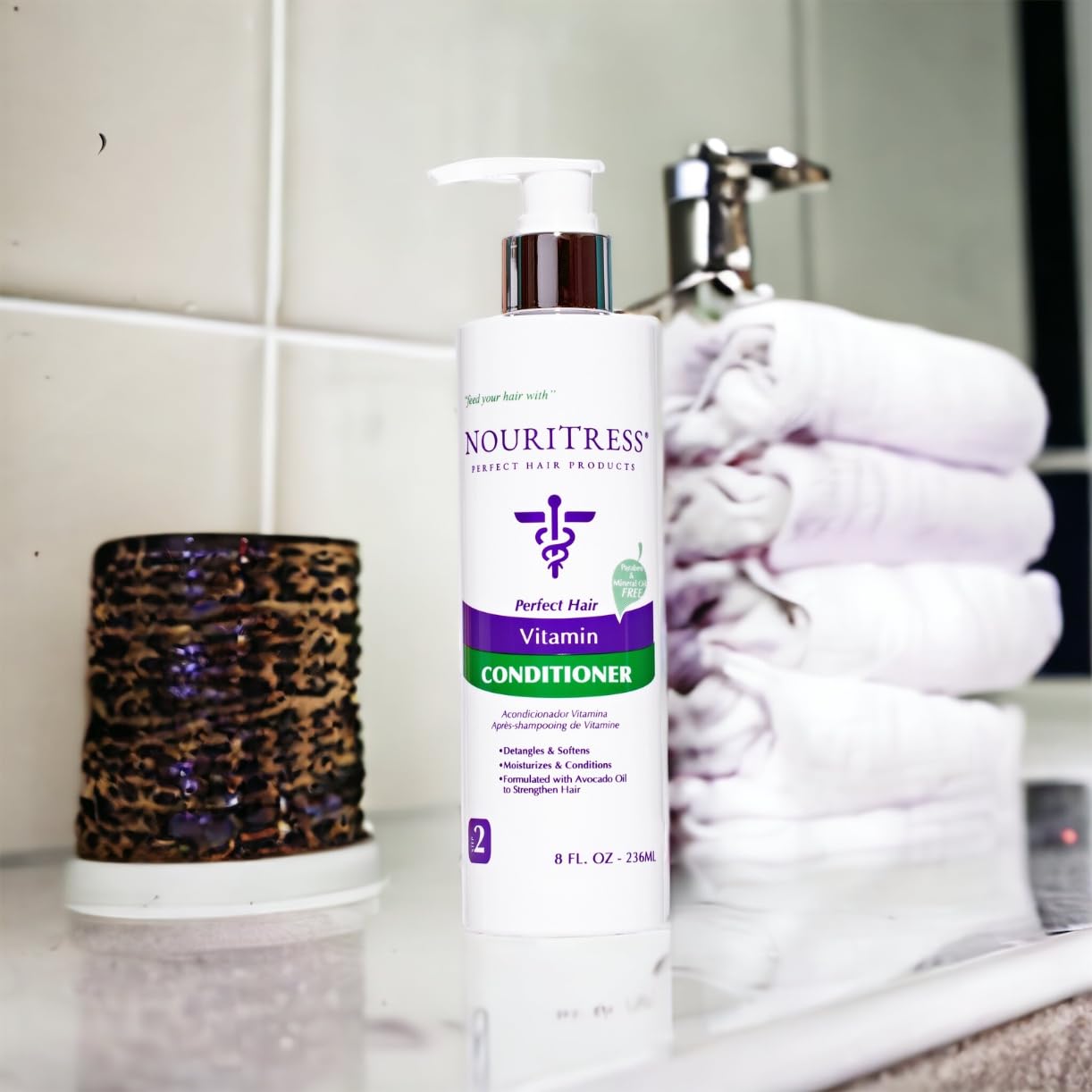 NouriTress Vitamin Conditioner avocado oil detail highlights deep moisture.