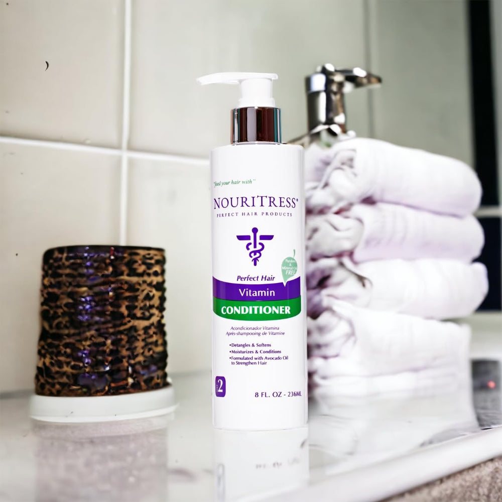 NouriTress Vitamin Conditioner avocado oil detail highlights deep moisture.