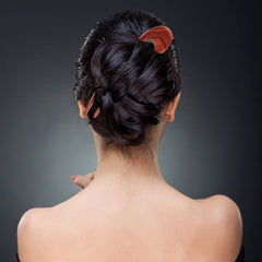 Noverlife handcrafted sandalwood hair clip highlighting natural grain and durability.