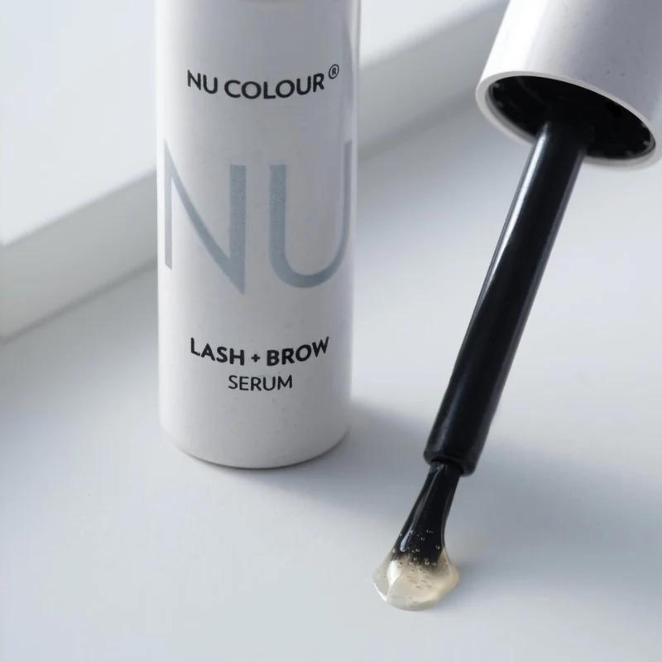 Nu Skin Nu Colour Lash + Brow Serum packaging highlights plastic-free design.