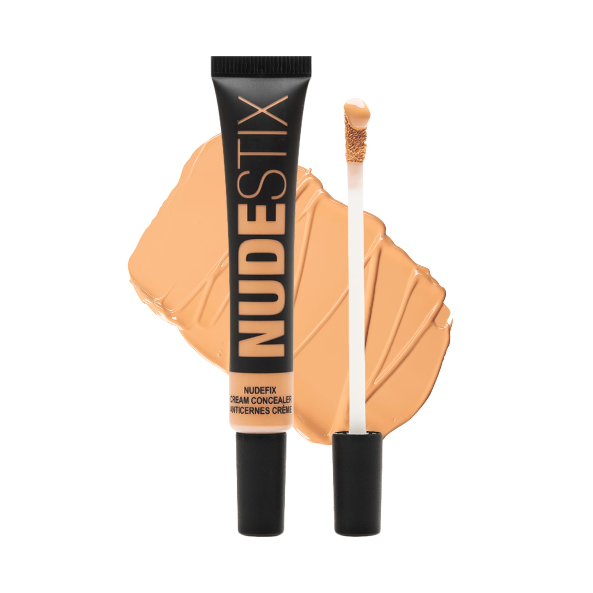 Nudestix Nudefix Cream Concealer under-eye application brightens dark circles for a refreshed look.