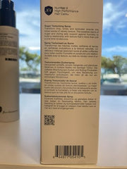 Number 4 Sugar Texture Spray on dry hair defines and refreshes style.